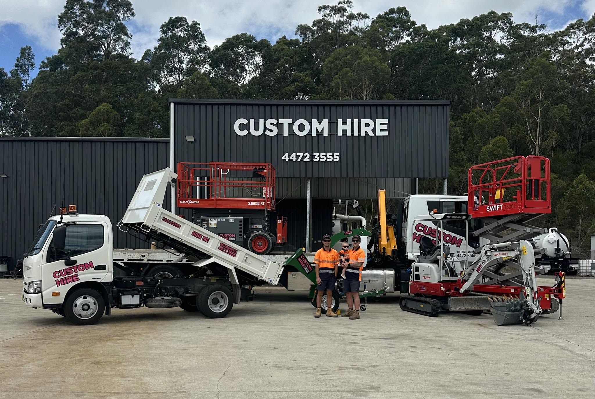 Ryan, Cameron and Peter in front of the Custom Hire depot with the fleet visible